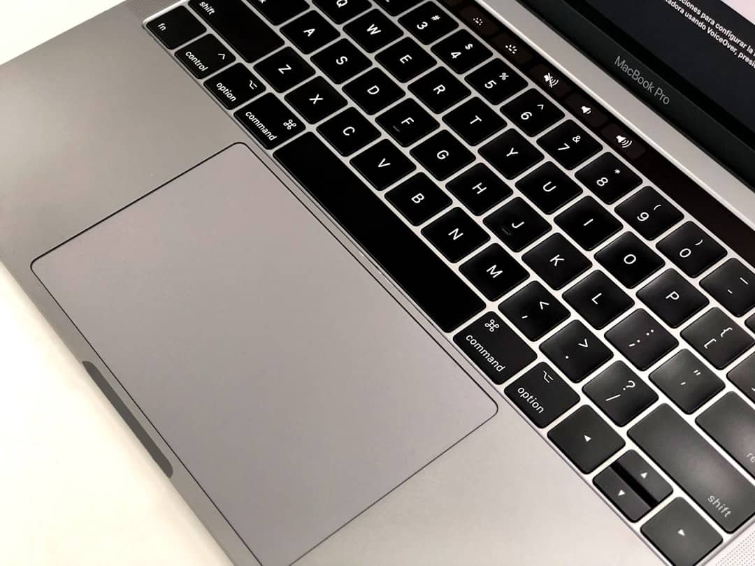 Silver laptop showing a close-up of the keyboard and touchpad.