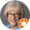 Profile picture of a person with short gray hair and glasses on a gray background, showcasing their design expertise. A small, orange badge with a white star in the corner adds a touch of creativity.