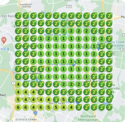 Map grid with colored circles displaying numbers from 1 to 6 overlays a bustling urban area with roads and landmarks, illustrating success stories through its strategic layout.