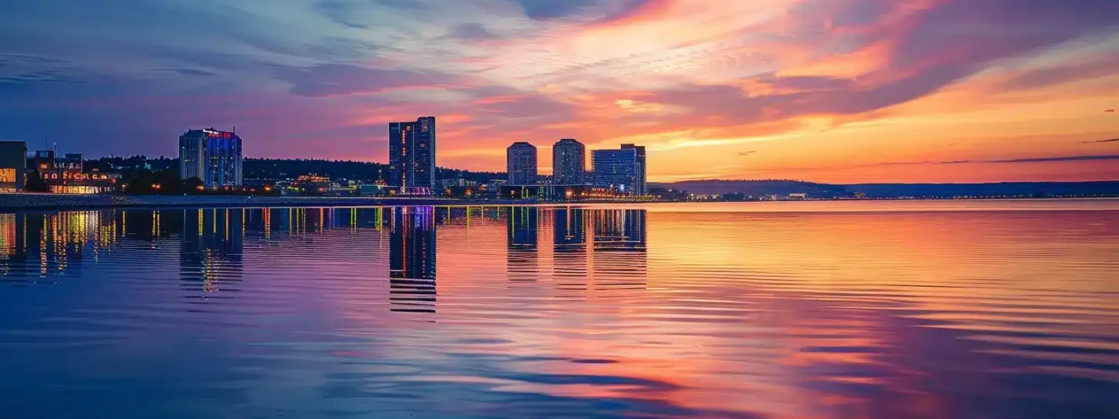 a vibrant skyline of traverse city at sunset reflects on the shimmering waters, showcasing the dynamic intersection of nature and technology essential for mastering seo.